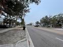 Street view of a residential area with a long road, sidewalks, and various houses on either side at 2900 Dr Martin Luther King Jr S St, St Petersburg, FL 33705