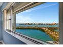 Breathtaking water view from a large window with the city skyline visible in the distance at 31 Island Way # 1403, Clearwater Beach, FL 33767