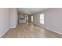 Spacious living area featuring an open floor plan and hardwood floors at 37155 Sagemoor Dr, Zephyrhills, FL 33541