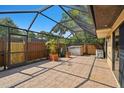 Spacious screened patio featuring tiled flooring, and ample outdoor space with open views at 706 1St Ct, Palm Harbor, FL 34684