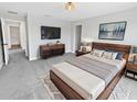 Comfortable bedroom with carpet, modern furniture, and ample natural light for a relaxing atmosphere at 8452 Silverbell Loop, Brooksville, FL 34613