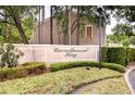 Landscaped Carrollwood Key entrance sign with lush greenery at 11304 Cayman Key Ave # 2, Tampa, FL 33624