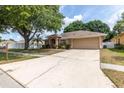 Attractive one-story home with a long driveway and appealing curb appeal at 11416 Wellman Dr, Riverview, FL 33578