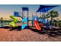 Colorful community playground with slides, climbing structures, and safety surfacing at 16511 66Th E Ln, Parrish, FL 34219