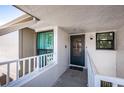 Welcoming entrance with a secure screen door and security camera at 2117 Lakewood Club S Dr # 7K, St Petersburg, FL 33712
