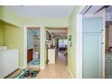 Inviting hallway leading to a bathroom, living area, and kitchen at 2117 Lakewood Club S Dr # 7K, St Petersburg, FL 33712