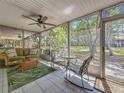 Screened lanai with comfortable seating and serene views of the surrounding landscape at 3620 41St S Way # B, St Petersburg, FL 33711