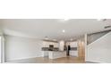 Spacious open-concept kitchen featuring an island with stainless steel appliances at 3860 Obsidian Dr, Spring Hill, FL 34609