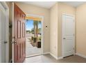 Inviting foyer with neutral walls and tile flooring, showcasing an open entryway and natural light at 9960 Hound Chase Dr, Gibsonton, FL 33534