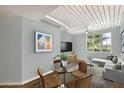 Contemporary living room with modern furnishings, art and ceiling features and lots of light at 2402 Azeele W St # 412, Tampa, FL 33609
