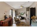 Comfortable living room featuring wood floors, vaulted ceilings, and neutral decor at 2816 Manor Hill Dr, Brandon, FL 33511