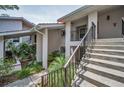 Condo exterior features clean lines, convenient stair access and lush tropical landscaping at 300 S Florida Ave # 200J, Tarpon Springs, FL 34689