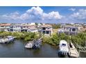 Stunning waterfront homes with private docks and boat lifts, perfect for boaters and enjoying the water at 3122 Christophers Watch Ln, Ruskin, FL 33570