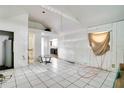 Bright, open living space features tile flooring and natural light from the window at 3212 56Th N Ave, St Petersburg, FL 33714