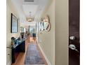 Elegant hallway with hardwood floors, sophisticated decor, and a view of the living area with city views at 449 S 12Th St # 2205, Tampa, FL 33602
