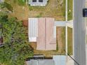 Aerial view of property showcasing the roof, driveway, yard, and surrounding neighborhood at 5033 Tammy Ln, Holiday, FL 34690