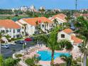 Aerial view of condos with a pool, parking, and easy access to nearby attractions at 6171 Bahia Del Mar Blvd # 216, St Petersburg, FL 33715