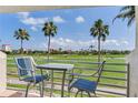 Balcony view features golf course and seating, perfect for relaxing and enjoying the scenery at 6171 Bahia Del Mar Blvd # 216, St Petersburg, FL 33715
