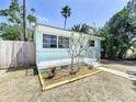 Delightful single-story home featuring a charming front porch and landscaped details at 627 64Th S Ave, St Petersburg, FL 33705