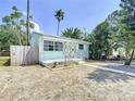 Charming single-story home with a well-manicured front yard and a quaint front porch at 627 64Th S Ave, St Petersburg, FL 33705