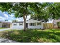 Charming renovated single-story home with new driveway and fresh landscaping and black trim at 8277 82Nd N Ave, Largo, FL 33777