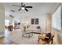 Bright living room featuring an open concept design with stylish decor and modern ceiling fan at 8277 82Nd N Ave, Largo, FL 33777