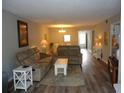 Spacious living room with wood flooring and comfortable seating at 860 Virginia St # 308, Dunedin, FL 34698