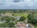 Panoramic aerial view of the property overlooking lush golf course and surrounding landscape at 13209 Palmilla Cir, Dade City, FL 33525