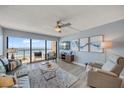 Cozy living room with ocean views, ceiling fan, and comfortable seating arrangement at 15000 Gulf Blvd # 602, Madeira Beach, FL 33708