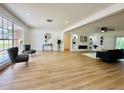 Spacious living room with new floors, recessed lighting, and an electric fireplace at 15307 Stonecreek Ln, Tampa, FL 33613
