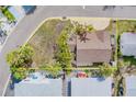 Aerial view highlighting property lines and showcasing the home's location within a residential area at 18198 3Rd E St, Redington Shores, FL 33708