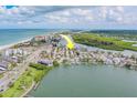 Aerial view of the coastal community with the home's location conveniently located between the beach and waterway at 18198 3Rd E St, Redington Shores, FL 33708