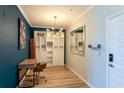 Modern home office featuring a stylish desk, ample storage, contemporary lighting, and neutral decor at 4221 W Spruce St # 1303, Tampa, FL 33607