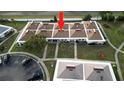 Birds eye view of a condo complex featuring well-maintained lawns and a parking area at 4345 Tahitian Gardens Cir # C, Holiday, FL 34691