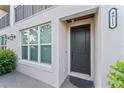 Elegant front entrance with a modern design, security camera, and address number at 4911 N Nebraska Ave, Tampa, FL 33603