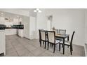 The dining room showcases tile floors and flows into the kitchen area at 5875 Darren N Ct, Clearwater, FL 33760
