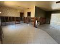 Spacious living room featuring ceramic tile, and ready for renovation to make your own at 8422 Boxwood Dr, Tampa, FL 33615