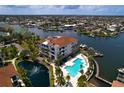 Stunning aerial view of a condo community featuring a pool and boat docks at 1003 Bellasol Way # 9203, Apollo Beach, FL 33572