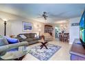 Inviting living room featuring tile floors, comfortable seating, ceiling fan, and combined dining area at 10037 62Nd N Ter # 9, St Petersburg, FL 33708
