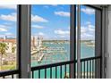 Scenic water view from a balcony, showing docks, boats, and waterfront properties on a sunny day at 10355 Paradise Blvd # 412, Treasure Island, FL 33706