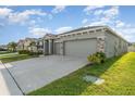 A beautifully landscaped single-Gathering home features a spacious driveway and a two-car garage at 12436 Shining Willow St, Riverview, FL 33579