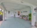 Inviting covered outdoor patio with comfortable seating, perfect for relaxing and enjoying the outdoors at 1902 Hanson Ct # 308, Sun City Center, FL 33573
