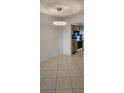 The dining area features tile floors and a modern light fixture near the kitchen at 2017 Skimmer W Ct # 413, Clearwater, FL 33762