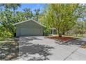 A single-Gathering home showcases a well-maintained exterior with an attached garage and a wide driveway at 3668 Pond View Ln, Sarasota, FL 34235