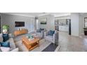 Inviting living room featuring modern decor and an open layout to the kitchen at 4558 23Rd N Ave, St Petersburg, FL 33713