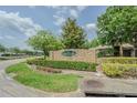 Entrance to the Lakeshore community surrounded by lush landscaping at 5317 Pagnotta Pl, Lutz, FL 33558