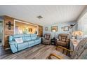 Bright living room with stylish seating and decorative wall accents at 6111 2Nd Ave, New Port Richey, FL 34653