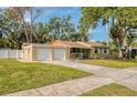 Charming single-story home with a well-manicured lawn and a two-car garage at 770 27Th S Ave, St Petersburg, FL 33705