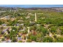 Picturesque aerial view of the property location near water and lush surroundings at 7813 Cadillac Ave, Hudson, FL 34667