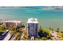 Aerial view of the high-rise condo with water views of the bay and waterfront at 80 Rogers St # 6D, Clearwater, FL 33756